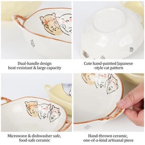 Peut inclure: Bol en c&eacute;ramique cr&egrave;me avec une conception &agrave; double poign&eacute;e. Le bol pr&eacute;sente un motif de chat de style japonais peint &agrave; la main et des empreintes de pattes. Le texte sur l'image dit "Microwave & dishwasher safe, food-safe ceramic".