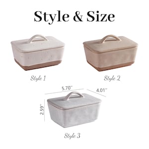 May include: A set of three ceramic mugs with a speckled, matte finish. The mugs are in shades of cream, light gray, and dark gray. Each mug has a simple, minimalist design, perfect for coffee or tea.