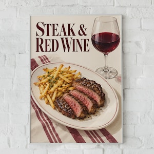 May include: A rectangular wall art print featuring the text STEAK & RED WINE in dark red serif font. The image displays a white oval plate with a sliced medium-rare steak and golden french fries, accompanied by a glass of deep red wine.