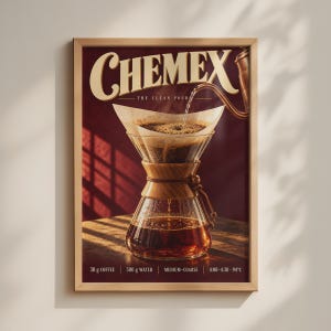 May include: A framed poster featuring a Chemex coffee maker with a paper filter and dark coffee. The text reads CHEMEX THE CLEAN POUR, 30 g COFFEE, 500 g WATER, MEDIUM-COARSE, and 4:00-4:30 94°C. The background is a deep red with warm lighting.
