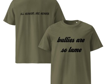 May include: Olive green t-shirts with black text. One shirt says "bullies are so lame" and the other says "ALL HUMANS ARE HUMAN". The shirts are short-sleeved and made of a soft material.