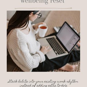 May include: Image promoting work-from-home wellbeing. A person wearing glasses and a white sweater holds a mug while using a laptop. Text reads "Work from home wellbeing reset" and "Stack habits into your existing work rhythm instead of adding extra to-do's."
