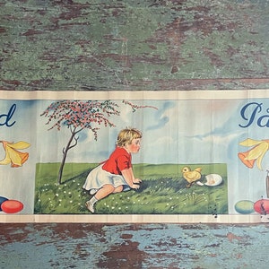 May include: A vintage Easter banner with the text "Glad Påsk" in blue lettering. The banner features a girl in a red shirt and white skirt looking at a yellow chick that has just hatched from an egg. The banner also features a blooming tree, daffodils, and willow branches.
