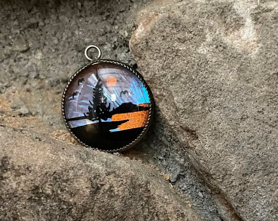 Vintage Pendant Morpho Reverse Painted Butterfly Wing Necklace Small Pine Tree Lake Scene in Black On Iridescent Purple Blue Orange Wing