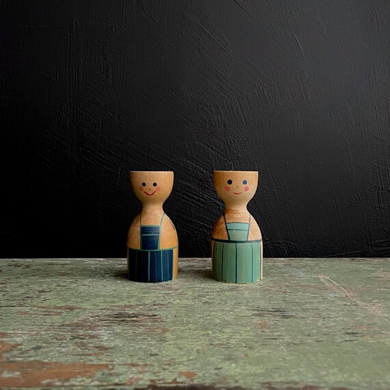 Vintage Wood Egg Cup Pair Wooden People Hand Painted Faces Green Blue Aprons Scandinavian Soft Boiled Holders Sweden w/ Holes Spoons Missing