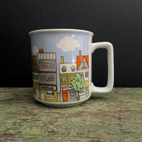 Vintage City Mug Town Scene Yellow Orange Buildings Shops Coffee Mug White Ceramic