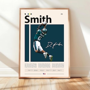 May include: A framed poster featuring a football player in a green and white uniform catching a ball. The player's name, "Smith," is displayed in large black letters above the image. The poster includes the player's signature and other text.