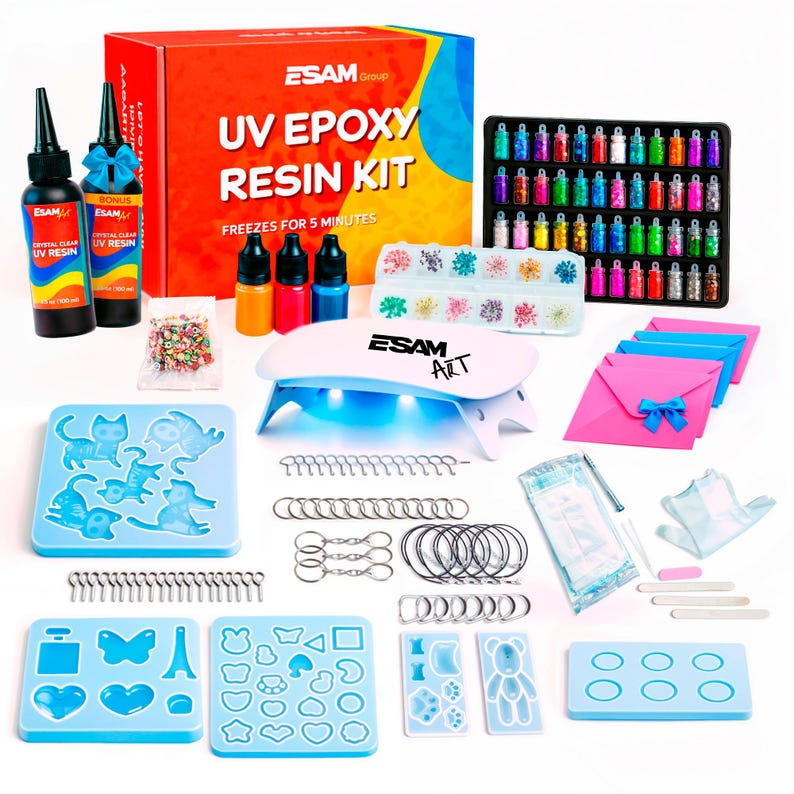 May include: A complete UV epoxy resin kit with various molds, glitter, and keychains. The kit includes UV resin bottles, color pigments, a UV lamp, and a variety of molds in different shapes. The box reads "UV EPOXY RESIN KIT" and "FREEZES FOR 5 MINUTES".
