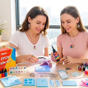 May include: Two women are seated at a table with a UV epoxy resin kit and various crafting supplies. The kit includes resin bottles, molds, and colorful pigments. The box reads "UV Epoxy Resin Kit".