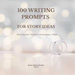 May include: A soft, blurred background with the text "100 WRITING PROMPTS FOR STORY IDEAS" and the subheadings "Short Stories • Novels • Screenplays • Plays." Two silver rings are in the foreground. The text "Quiet Library Studio Vol. 2" is at the bottom.