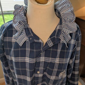 May include: A set of three ceramic mugs with a speckled, matte finish. The mugs are in shades of cream, light gray, and dark gray. Each mug has a simple, minimalist design and a rounded handle.