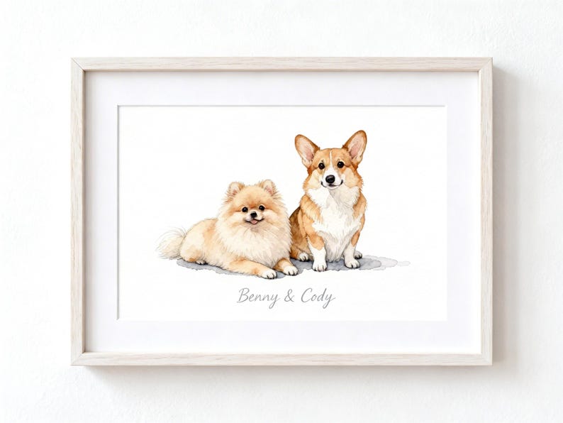 May include: A framed watercolor print featuring a fluffy tan Pomeranian lying down next to a seated tan and white Corgi. The text Benny & Cody is printed in a light gray script font centered below the two dogs on a white background.