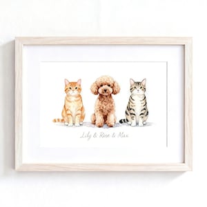 May include: A framed watercolor print featuring an orange tabby cat, a brown curly-haired poodle, and a grey tabby cat sitting side-by-side. Below the animals, the text Lily & Rose & Max is printed in a simple, elegant, light grey script font.