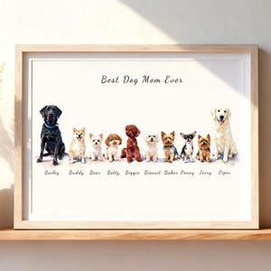 以下が含まれることがあります： 11匹の犬が並んだ水彩画風のイラストが描かれた額入りプリント。上部には「Best Dog Mom Ever」という文字があり、各犬の下にはBailey、Buddy、Bear、Betty、Biggie、Biscuit、Baker、Penny、Jerry、Piperという名前が記されています。