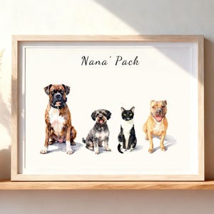 May include: A framed watercolor print featuring the text Nana' Pack above four animals: a brown and white Boxer dog, a small gray and black curly-haired dog, a black and white cat, and a tan pit bull-type dog, all sitting on a white background.