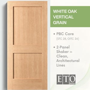May include: A two-panel white oak door with vertical grain. The door has a light brown color and a simple, clean design. The text on the right side of the door says "WHITE OAK VERTICAL GRAIN".