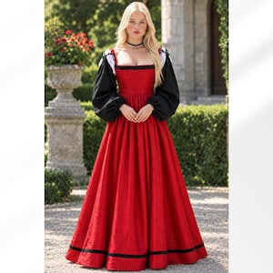 May include: A floor-length red dress featuring a square neckline, long black puff sleeves with white cuffs, and a subtle textured pattern. The bodice is fitted, transitioning into a full, pleated skirt with a black horizontal band near the hem.