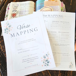 May include: Two white paper sheets titled Verse Mapping, a guided workbook for studying God's Word, featuring eucalyptus leaf illustrations. One sheet shows a name and date field, the other displays sections for observe, dig deeper, and compare translations.