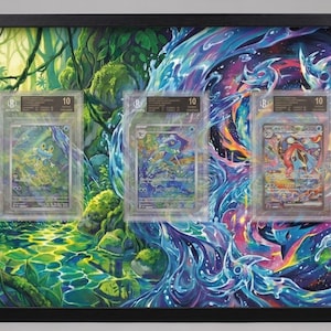 May include: Framed artwork featuring three graded trading cards set against a vibrant, split-scene background. One side depicts a lush green forest, the other a swirling, colorful cosmic design. Each card is encased in a protective holder.