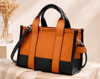 ツートンカラーのレザートートバッグ、ミニマルなショルダーバッグ、普段使いにぴったりのラグジュアリースタイル