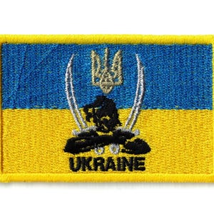 May include: A rectangular embroidered patch featuring the blue and yellow colors of the Ukrainian flag. The design includes a central gold trident emblem, two crossed silver swords, a black silhouette of a warrior, and the word UKRAINE in black.