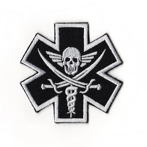 May include: Black and white embroidered patch featuring a skull with crossed swords and wings, set within a star-shaped emblem. The design includes a medical symbol, creating a unique and edgy aesthetic.