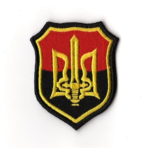 May include: A set of three ceramic mugs with a speckled, matte finish. The mugs are in cream, light grey, and dark grey. Each mug has a simple, minimalist design, ideal for coffee or tea.