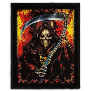 May include: A rectangular black patch featuring a Grim Reaper illustration. The Reaper, with a skull face and red eyes, is cloaked in black and holds a scythe. The background is a fiery mix of red and yellow.