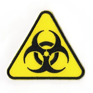 Parche triangular de riesgo biológico / Logotipo amarillo de precaución sobre la contaminación por residuos tóxicos nucleares
