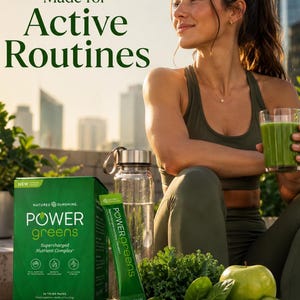 A high-energy lifestyle photo titled "Made for Active Routines." A woman in athletic wear is resting outdoors with a glass of green juice and a water bottle. A box of Power Greens is on a stone table with fresh kale, spinach, apples, and lime.