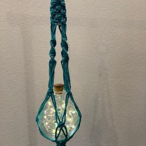 May include: A set of three ceramic mugs with a speckled, matte finish. The mugs are in shades of cream, light gray, and dark gray. Each mug has a simple, minimalist design and a rounded handle.