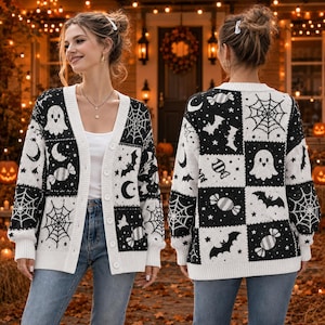 May include: A long-sleeve button-down cardigan featuring a black and white checkerboard pattern with repeating motifs of ghosts, spiderwebs, crescent moons, bats, and wrapped candies. The knit garment has a V-neckline and ribbed cuffs.