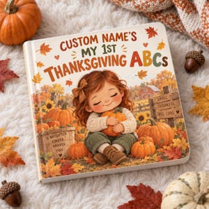 May include: A square children's book titled Custom Name's My 1st Thanksgiving ABCs, featuring an illustration of a child with auburn hair holding a pumpkin. The cover includes autumn leaves, sunflowers, and wooden signs with text, set against a white background.