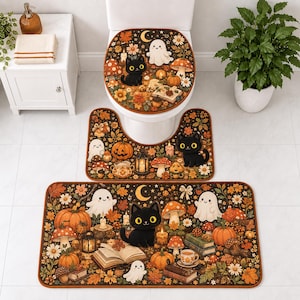 May include: A three-piece bathroom rug and toilet seat cover set featuring a dark brown background with a repeating pattern of black cats, white ghosts, orange pumpkins, mushrooms, autumn leaves, books, and candles in a festive seasonal design.