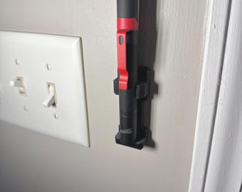 Soporte de pared para luz de trabajo LED Milwaukee M12 Stick Light/Organizador de luces de trabajo LED