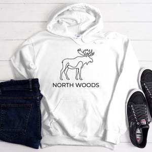 May include: A rustic wooden sign with the text "Welcome" in white lettering. The sign features a distressed finish and a simple, inviting design, perfect for a front porch or entryway.