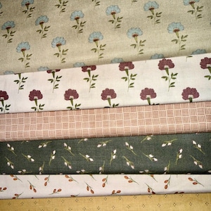 May include: A collection of various fabric swatches with floral and geometric patterns. The fabrics feature designs in shades of blue, burgundy, green, and gold. The patterns include small flowers, sprigs, and a grid-like design, suitable for quilting or crafting.