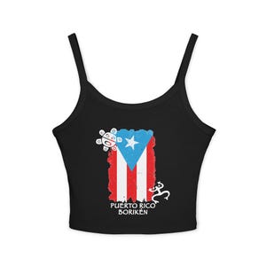 May include: Black tank top featuring the Puerto Rican flag design with a white star and stripes. The top includes the text "Puerto Rico Borikén" and two white graphic symbols. A stylish and patriotic apparel item.