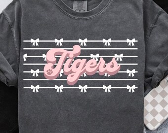 Pink tigers bow png, coquette bow stripes, tiger mascot png