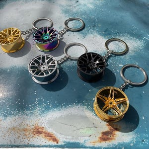 Charm porte-clés roue à rayons en métal