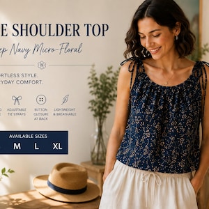 May include: A deep navy blue sleeveless top with a micro-floral pattern, featuring a gathered neckline and adjustable tie shoulder straps. The text reads: TIE SHOULDER TOP, Deep Navy Micro-Floral, EFFORTLESS STYLE. EVERYDAY COMFORT., GATHERED NECKLINE, ADJUSTABLE TIE STRAPS, BUTTON CLOSURE AT BACK, LIGHTWEIGHT & BREATHABLE, AVAILABLE SIZES S M L XL.