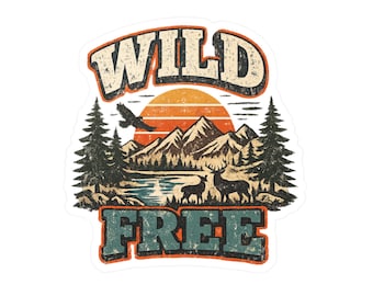May include: A die-cut sticker featuring a vintage-style landscape illustration with the text WILD at the top and FREE at the bottom. The design includes a setting orange sun, dark green pine trees, mountains, a lake, a flying bird, and two deer.