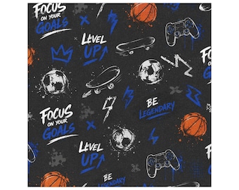 May include: A black fabric pattern featuring orange basketballs, white soccer balls, black game controllers, and skateboards. The design includes blue and white text reading Focus On Your Goals, Level Up, and Be Legendary, with lightning bolt and crown icons.