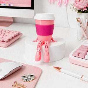 May include: A set of three ceramic mugs with a speckled, matte finish. The mugs are in shades of cream, light gray, and dark gray. Each mug has a simple, minimalist design, perfect for coffee or tea.