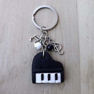 A forma di cuore Austria-musica-simbolo portachiavi nota musicale  portachiavi auto metallo violino-pianoforte-insegnante