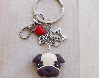 Handmade pug dog keychain in polymer clay with heart, paw and bone charms in Tibetan silver, perfect gift for dog lovers