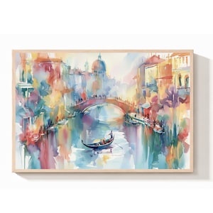 May include: A watercolor painting depicting a Venetian canal scene with a gondola floating under an arched stone bridge. The composition features soft, blended washes of blue, yellow, orange, and red, capturing buildings and reflections.
