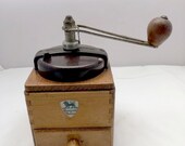 A vintage Peugeot coffee grinder with bakelite lid, kitchenware