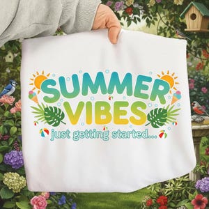 May include: White fabric with the words "SUMMER VIBES" in a gradient of blue, green, and yellow, with sun and ice cream cone graphics. The text "just getting started..." is below the main text.