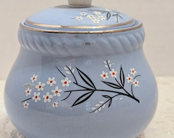 Zuccheriera vintage Homer Laughlin in carta kraft blu con coperchio, decorazione floreale e bordo argentato, stile metà secolo, prodotta negli Stati Uniti.
